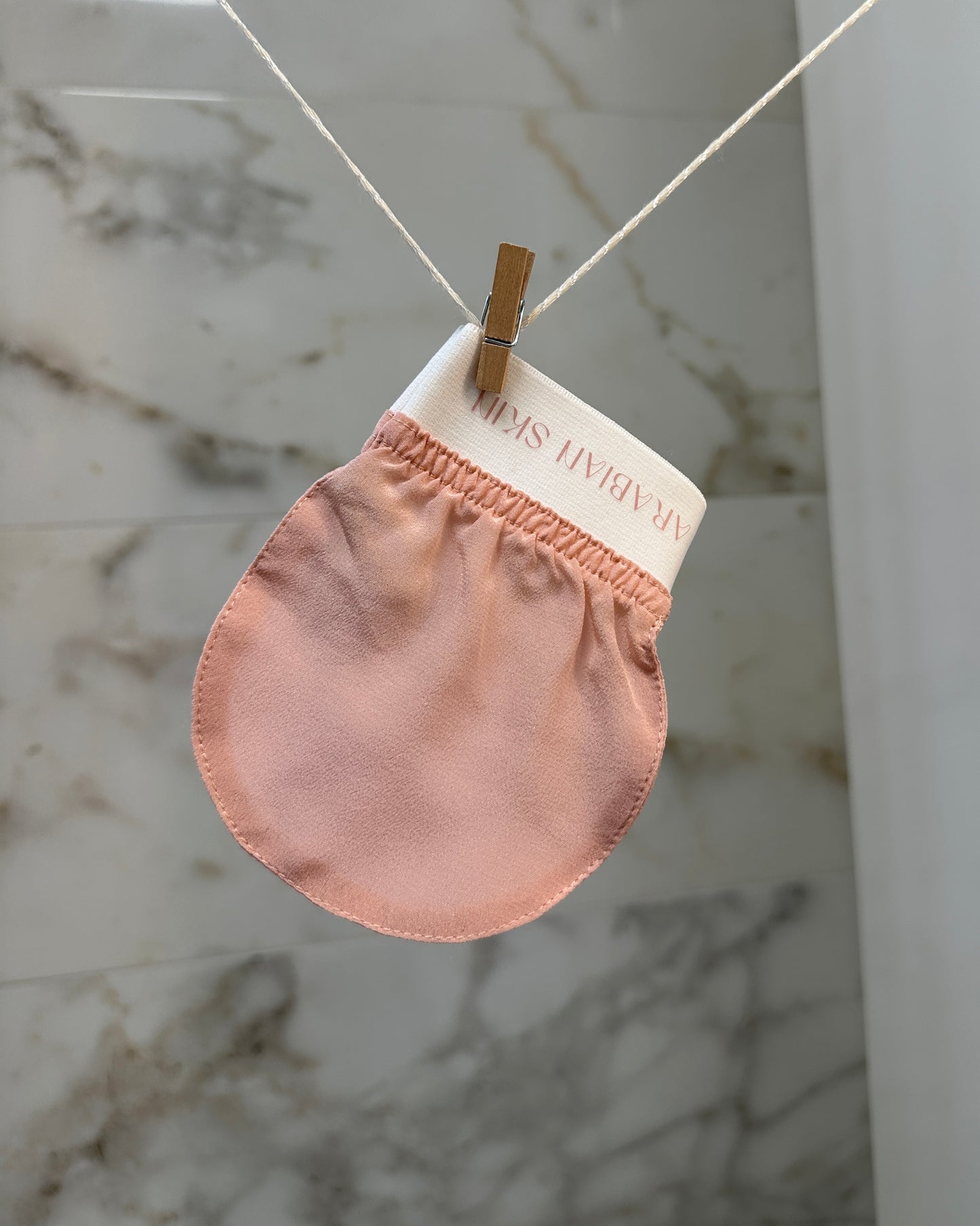 Ton gant exfoliant en soie - visage